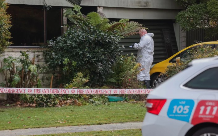 An investigator at the fire scene today. Photo: RNZ / Louis Dunham