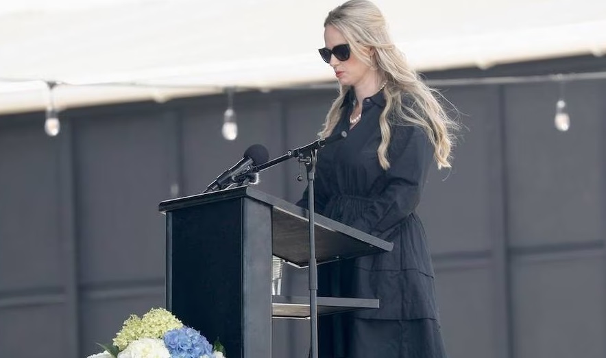 David van Zwanenberg's wife Amy speaks at her husband's funeral in Muriwai. Photo: NZ Herald