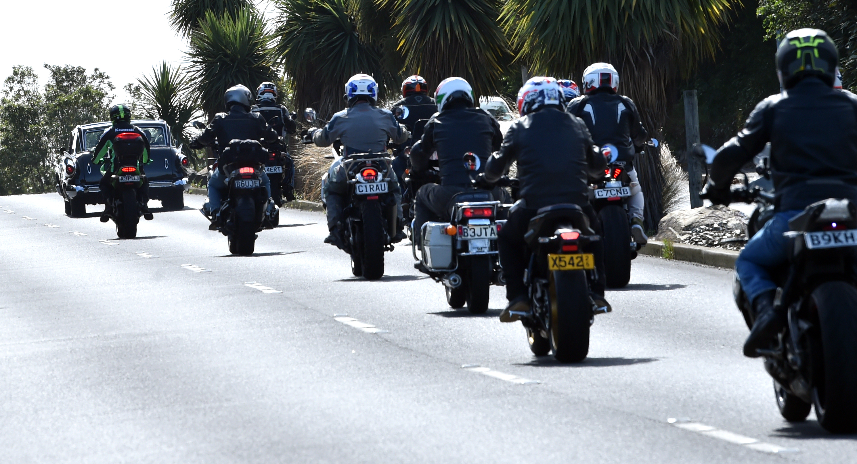 Jules Radich's hearse is accompanied by an escort of motorcycles. Photo: Peter McIntosh