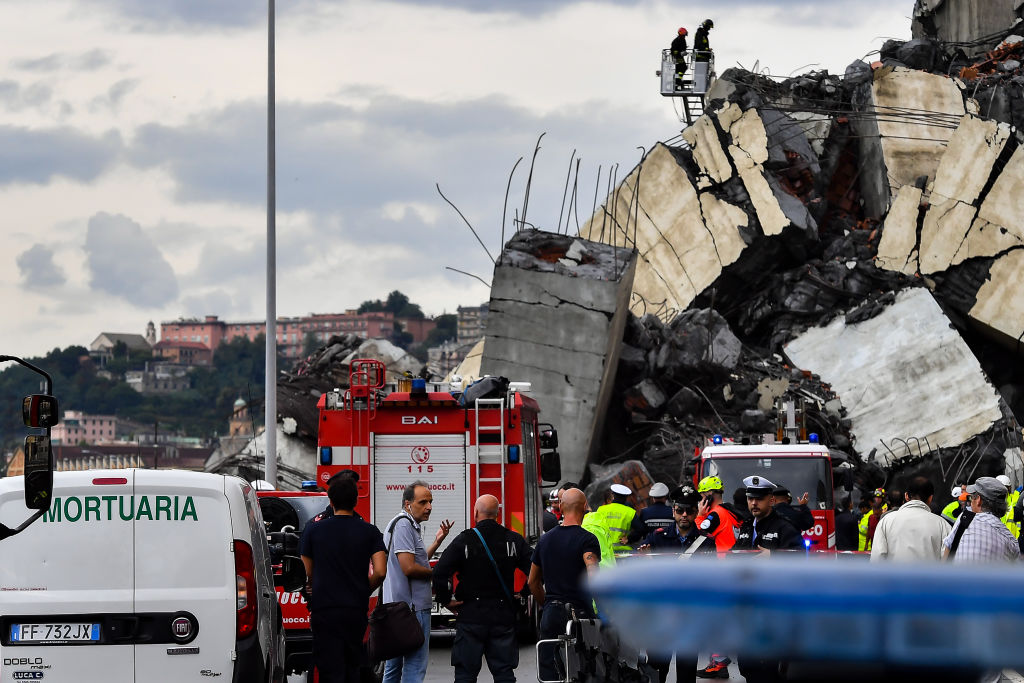 Rescue workers at the scene near the collapsed bridge. Photo: Getty