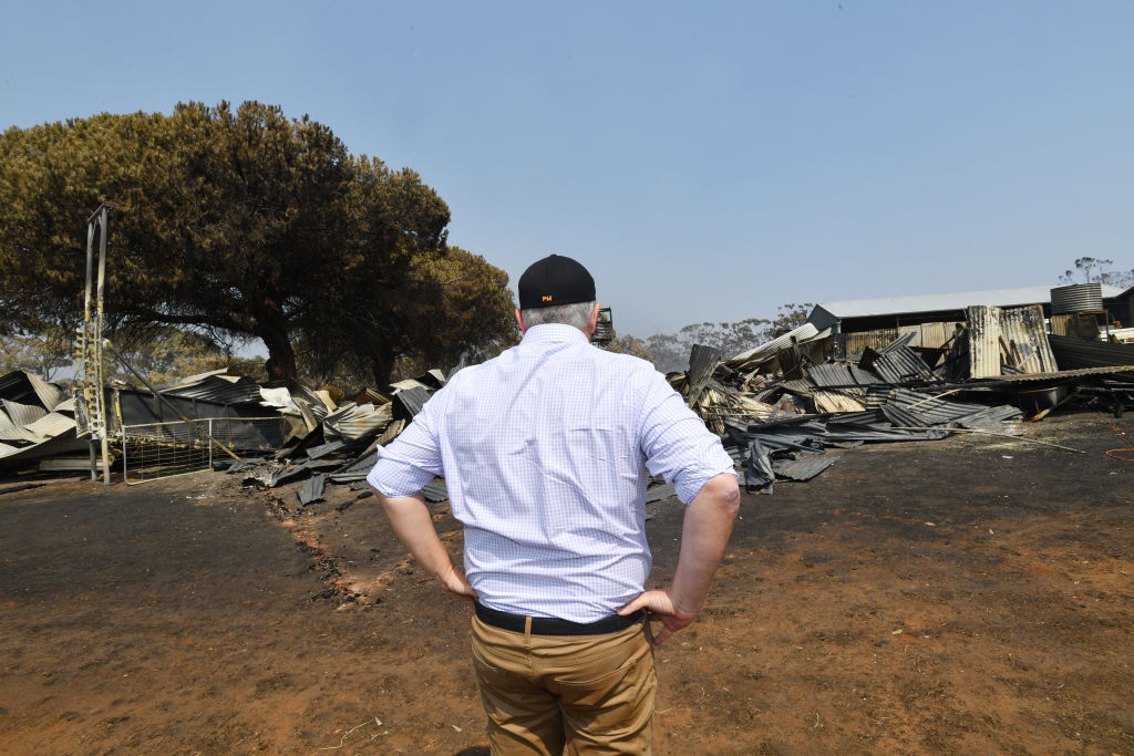 Australian Prime Minister Scott Morrison visits a fire-damaged property at Stokes Bay on Kangaroo...