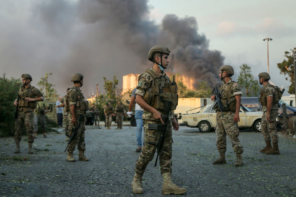 Lebanese soldiers stand guard near the site of the explosion in Beirut's port. Photo: Getty Images