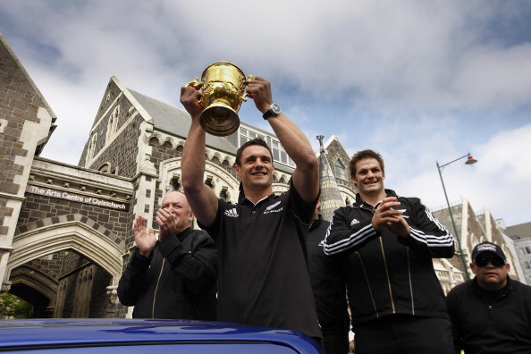 Dan Carter and Richie McCaw wave to the crowd with the Webb Ellis Cup after the All Blacks won...