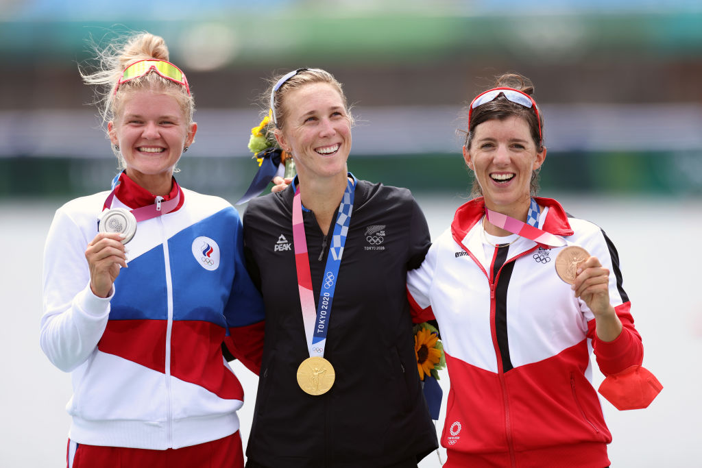 Gold medal winner Emma Twigg, of New Zealand (centre), is flanked by Team ROC's Hanna Prakatsen ...