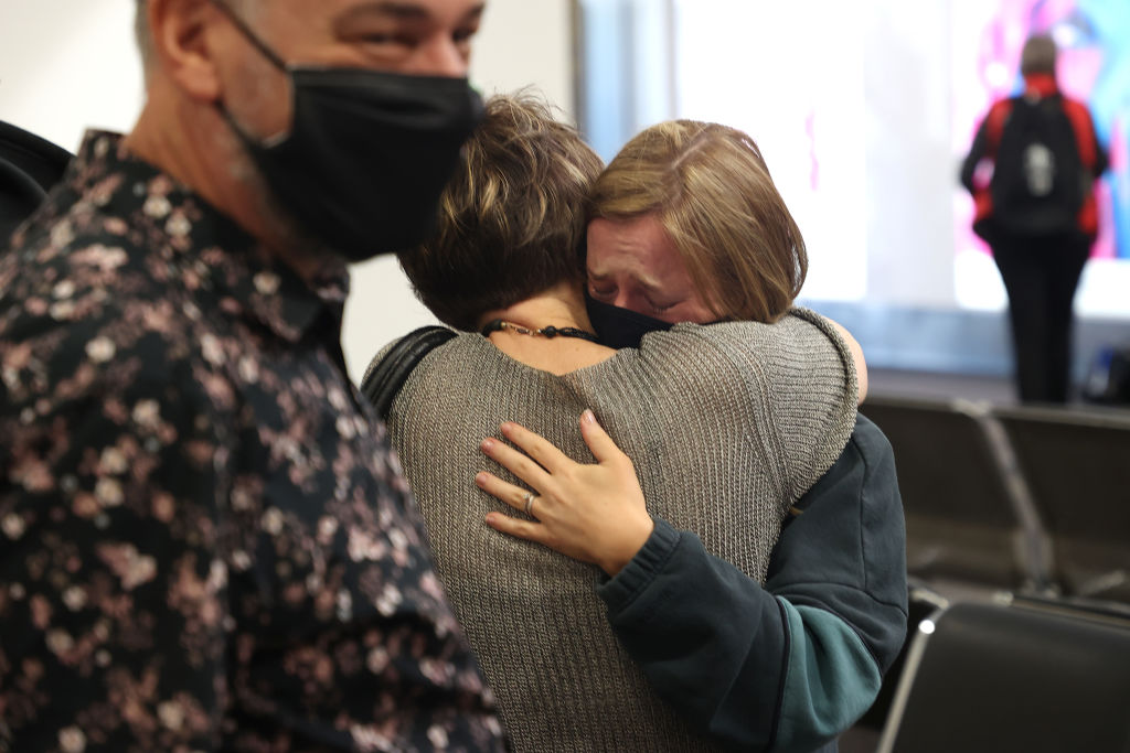 A mother and daughter hug as they reunite at Auckland Airport. File photo: Getty