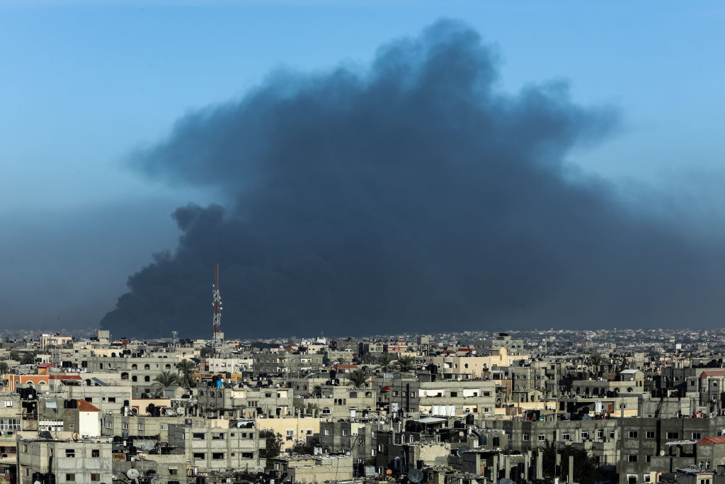 Smoke rises from damaged residential buildings following the Israeli attacks on Khan Yunis in...