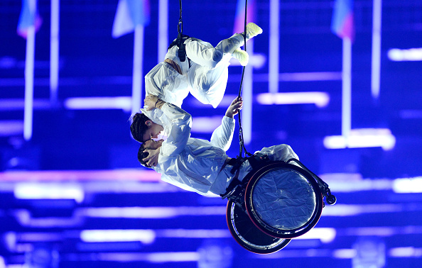Aerialists from Il Posto Vertical Dance Company perform during the Milano Cortina Paralympics...