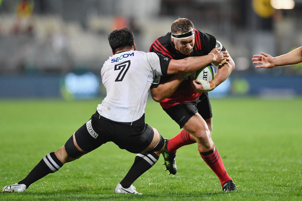  Crusaders prop Wyatt Crockett (right) charges into Sunwolves flanker Shunsuke Nunomaki during their Super Rugby match in Christchurch last night. The Crusaders  won 50-3, their seventh victory from as many games this season. PHOTO: GETTY IMAGES