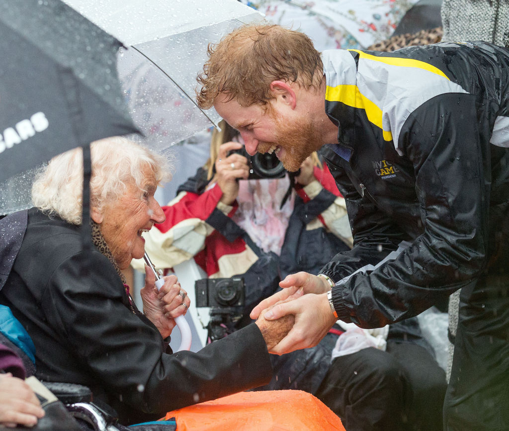 Prince Harry meets Daphne Dunne on a walkabout on Circular Quay in Sydney, during a day of events...