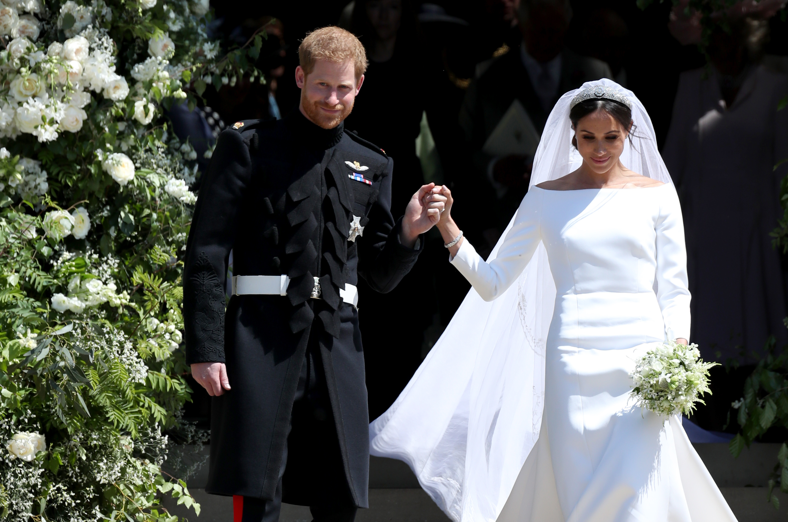 Prince Harry and Meghan Markle leave St George's Chapel in the grounds of Windsor Castle. Photo:...