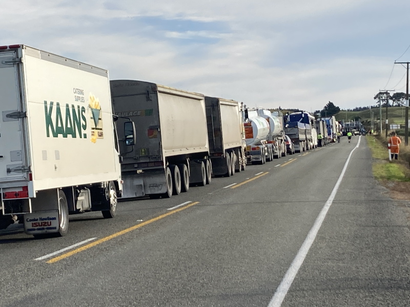 Trucks were backed up at the site of the two-vehicle crash near Hampden. Photo: Stephen Jaquiery