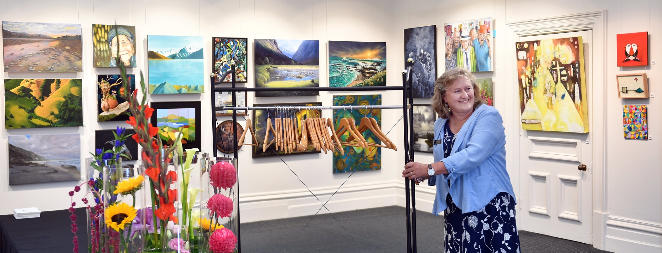 Otago Art Society council president and exhibition lead Rose Shepard makes some last-minute...