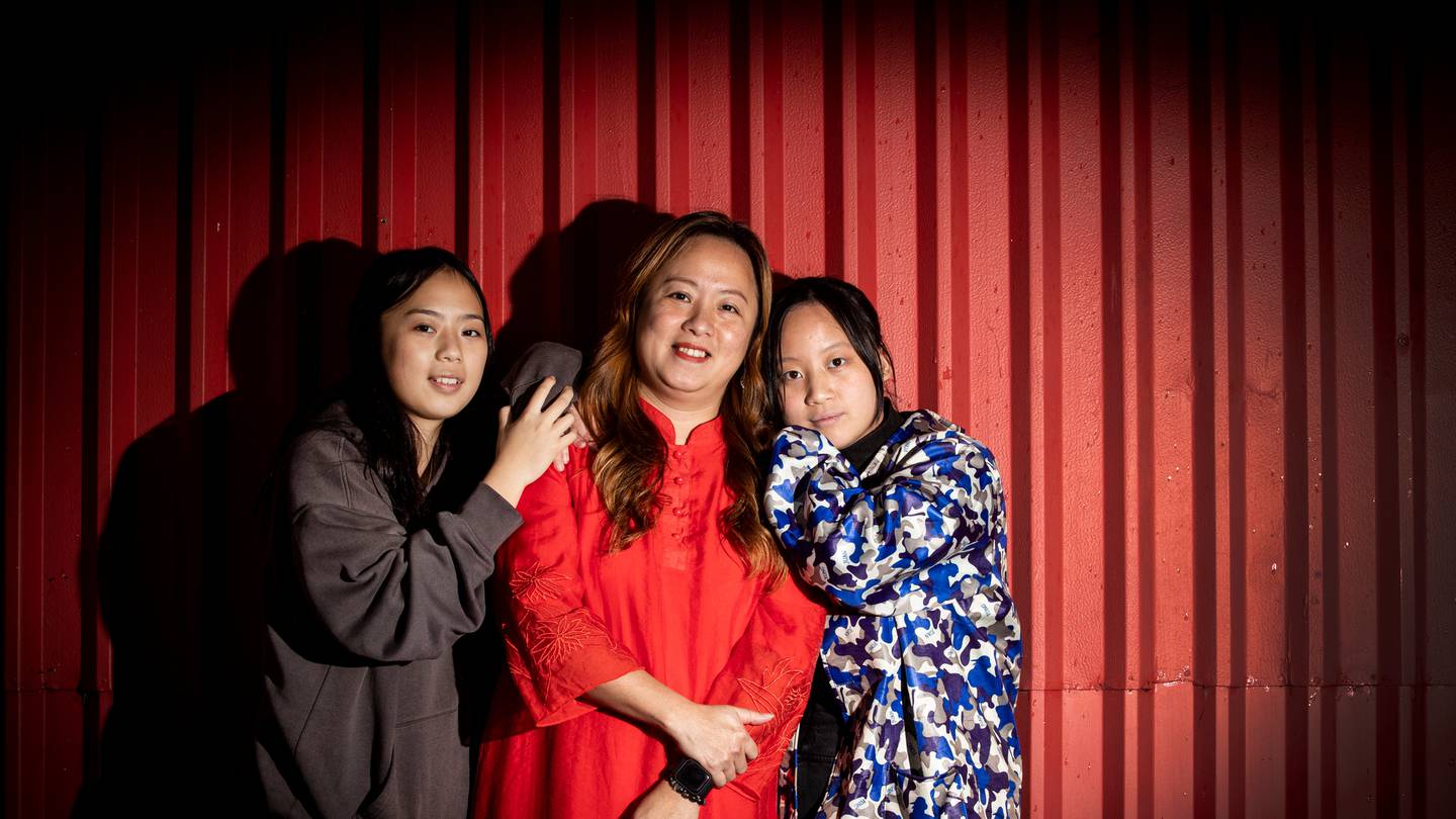 Eva Chen with her teenage daughters Claudia and Annemarie Wen. Photo: NZ Herald