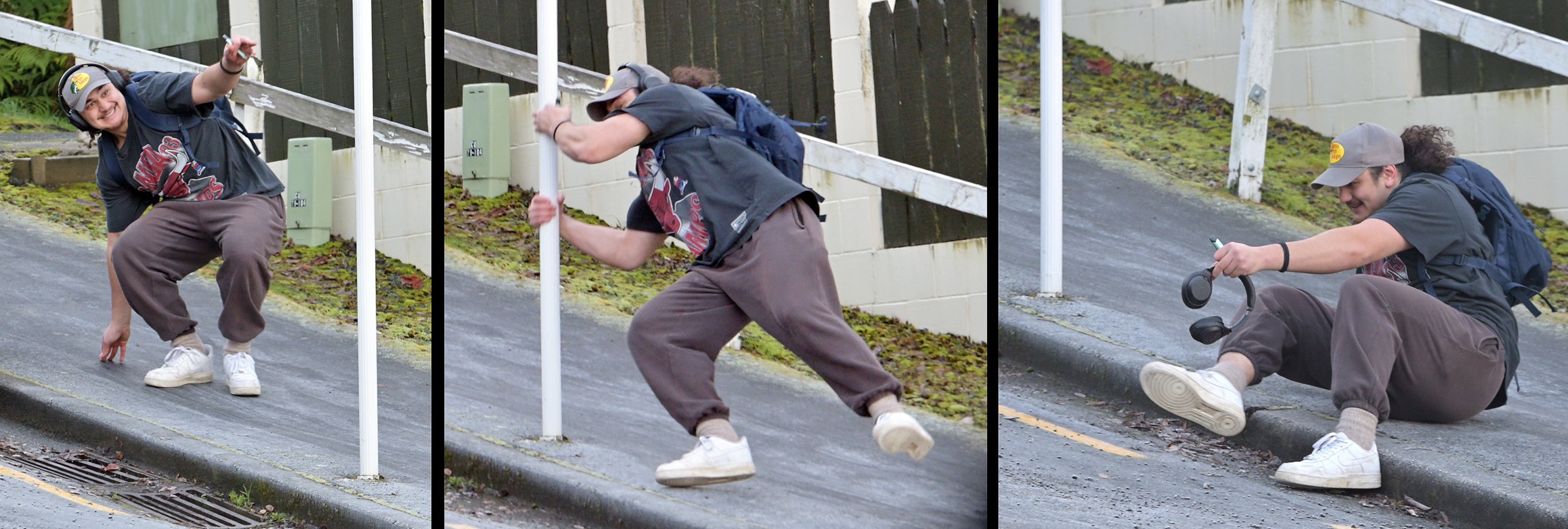 A pedestrian clutches a street sign to arrest his descent down Queen St, in North Dunedin,...