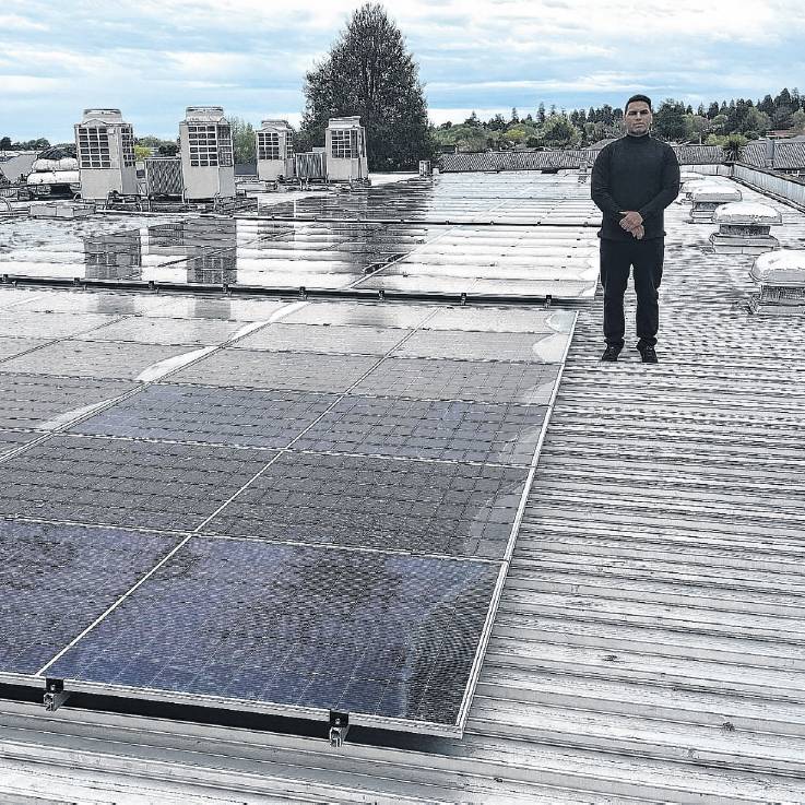 Hotel Ashburton owner Johny Singh shows off the hotel’s 176 solar panels. PHOTO: SUPPLIED