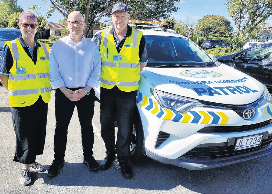 Waimakariri MP Matt Doocey flanked by Rangiora Community Patrol volunteers Christine Norton (left...