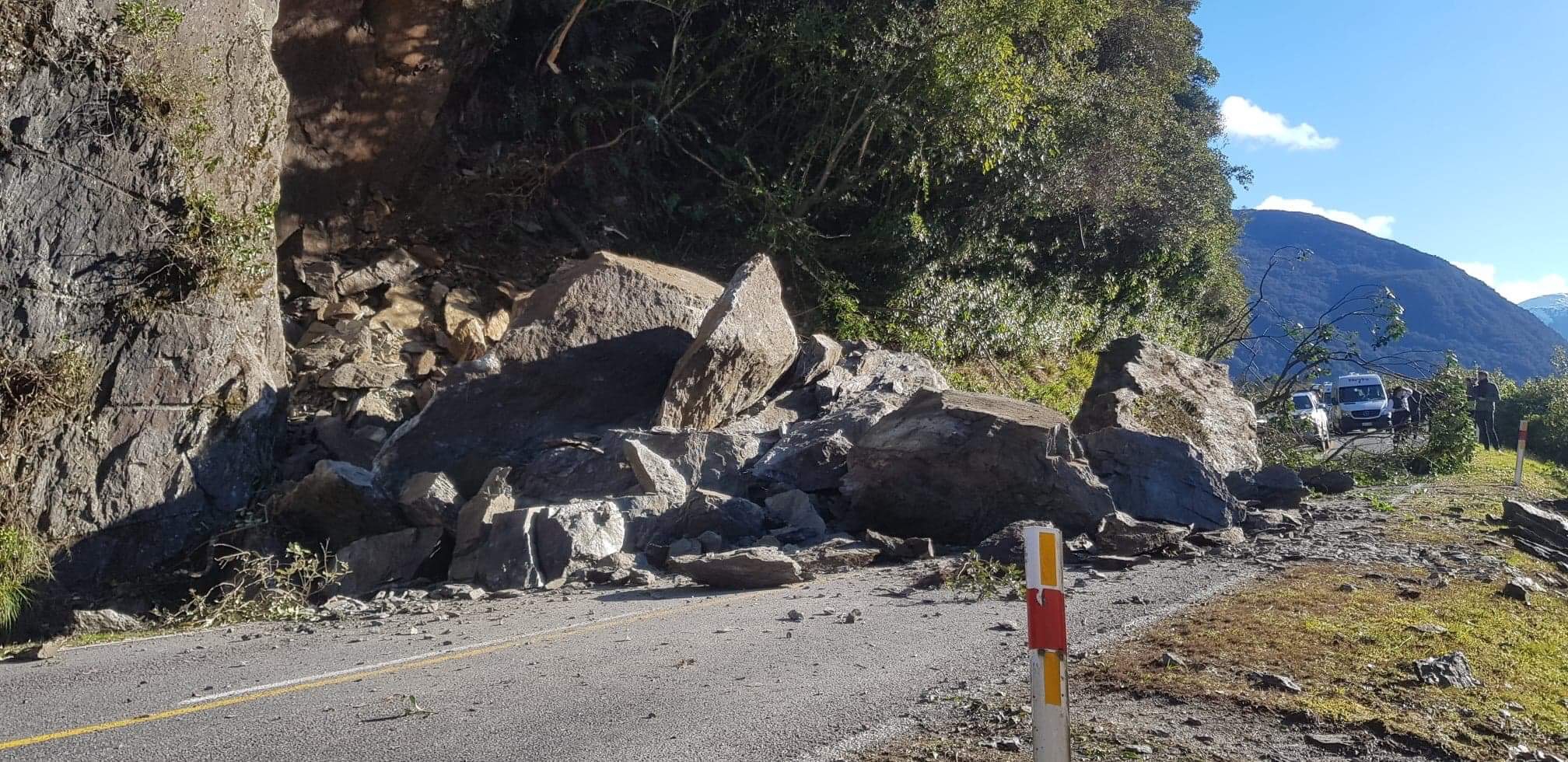 The rocks have been stockpiled to one site and are being removed. It's hoped both lanes of SH6...