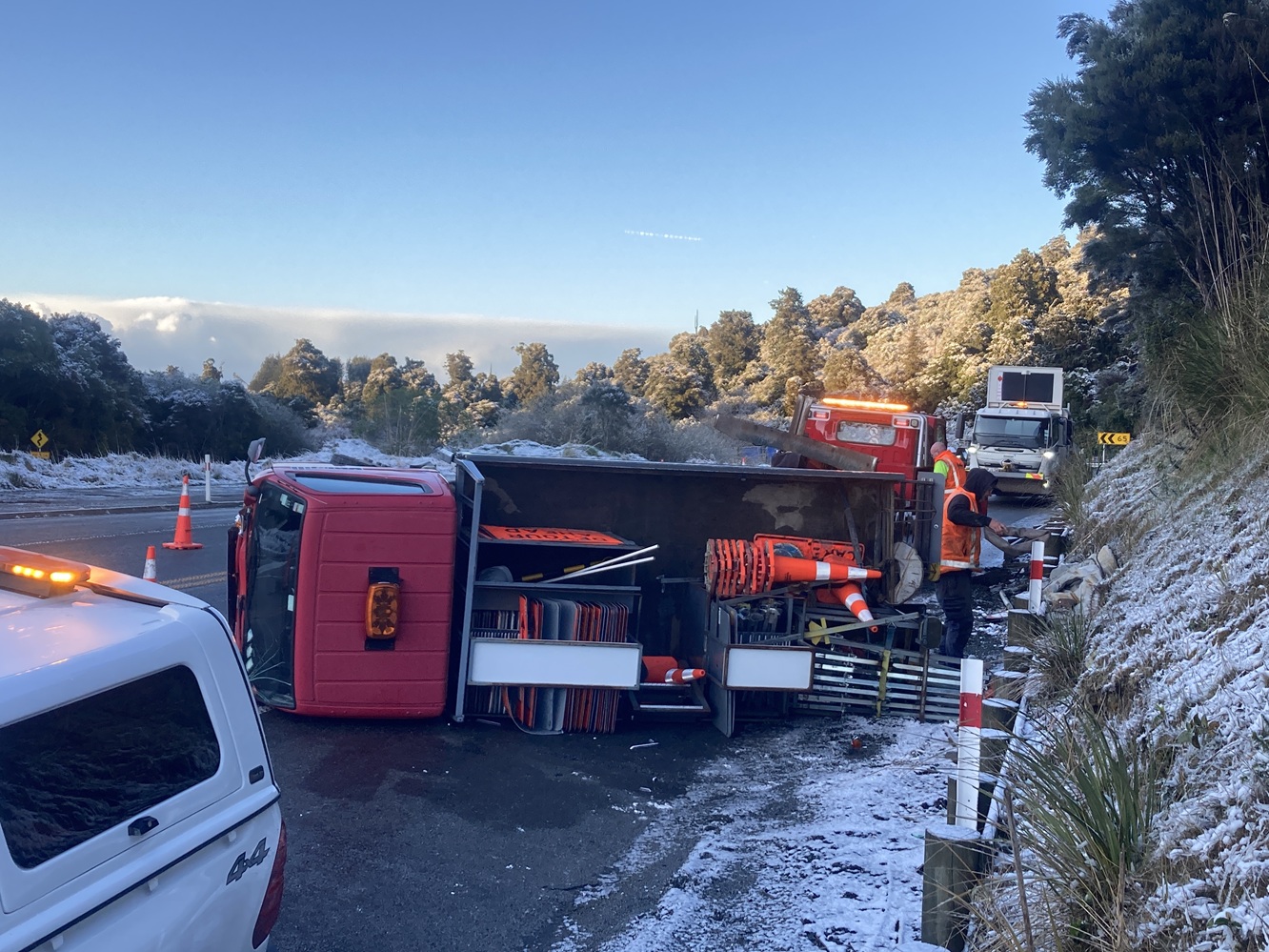A traffic management truck rolled at the top of Dunedin's Northern Motorway, where snow has...