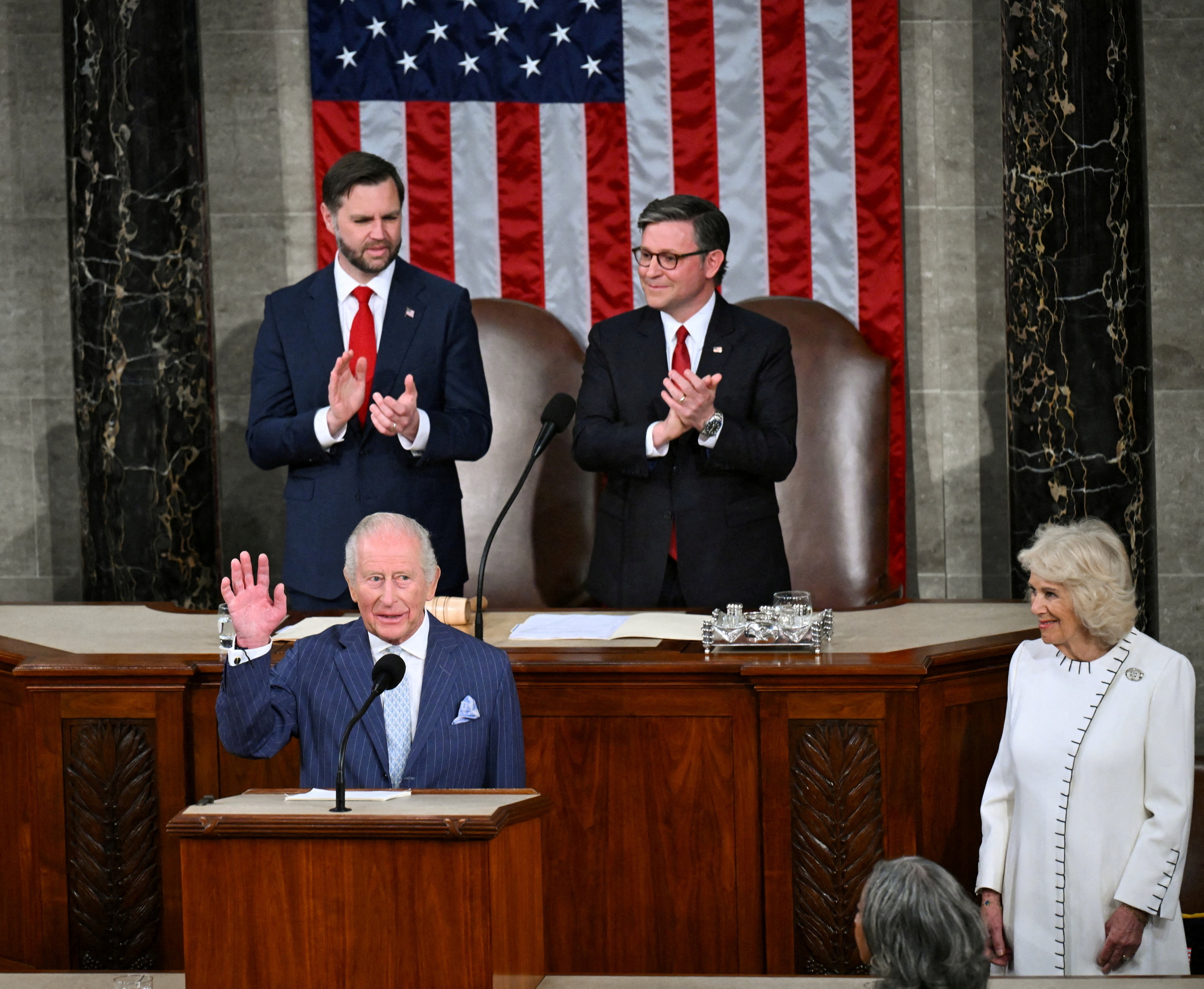 US Vice President JD Vance (back left) and and US House Speaker Mike Johnson applaud as King...