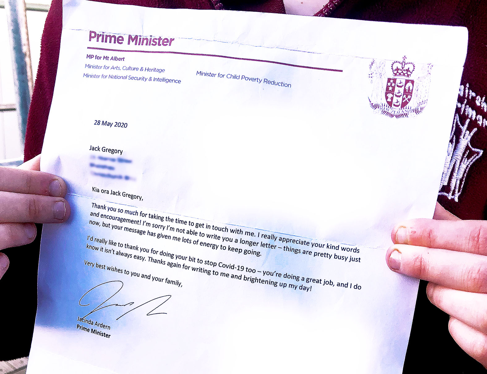 Jack with Ardern's letter. Photo: Bea Gooding