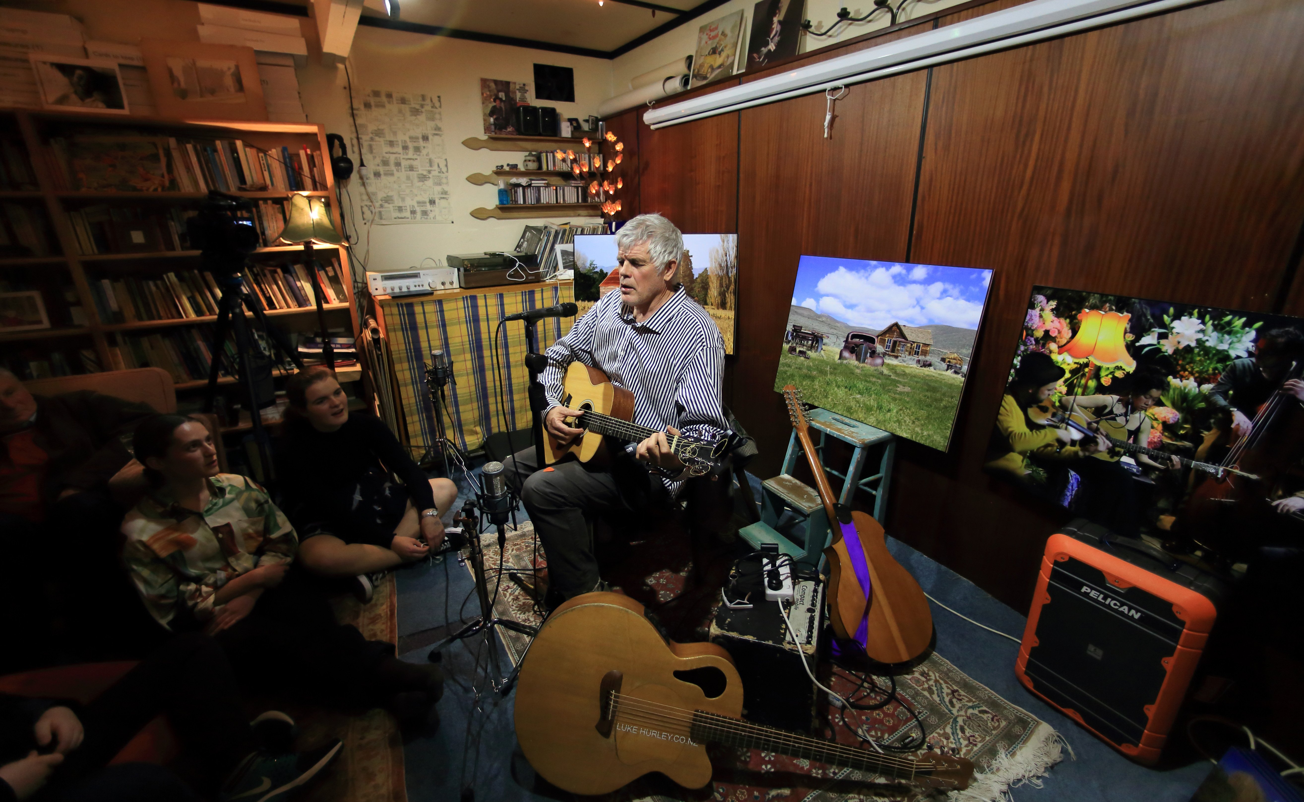 Luke Hurley plays a living room concert. Photo: Mark Thompson