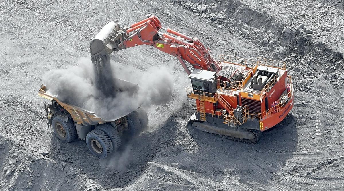 Rock is dropped on to a dump truck at Macraes gold mine. FILE PHOTO: STEPHEN JAQUIERY