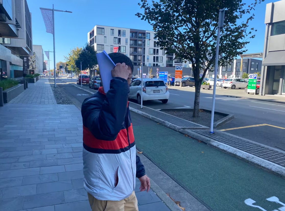 Rongjian Feng outside the Christchurch District Court where he was sentenced for wilful ill...