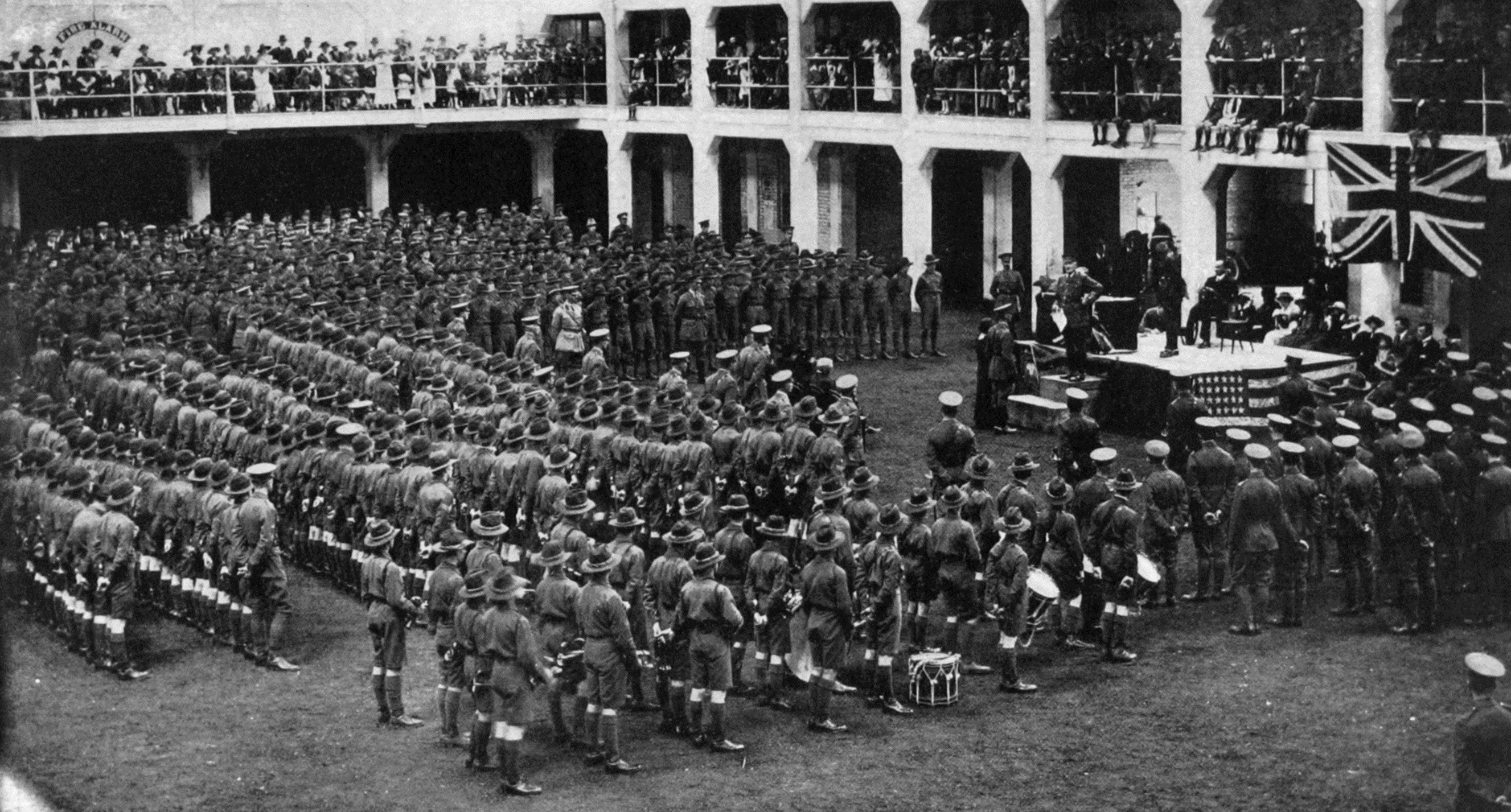 Sir James Allen hands out medals in the Kensington Drill Hall, Dunedin. That was the easy bit....