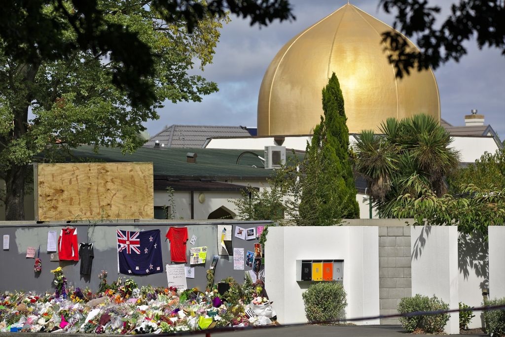 Flowers and flags have been left outside the Al Noor mosque where many of those killed were...