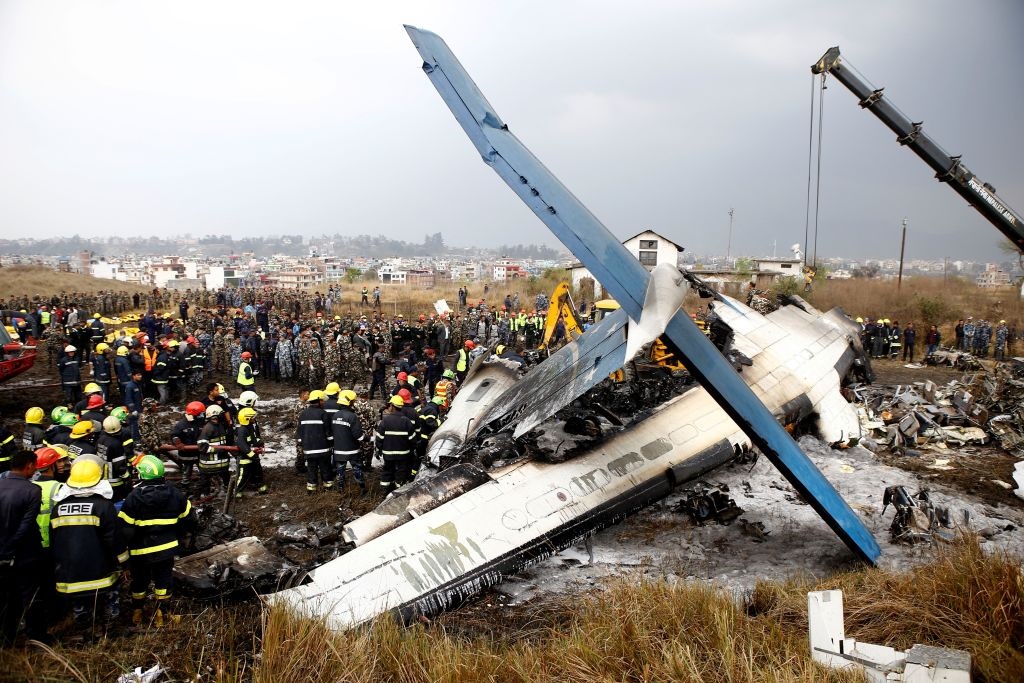 The plane skidded off the Kathmandu runway on to surrounding grass, quickly catching fire. Photo:...