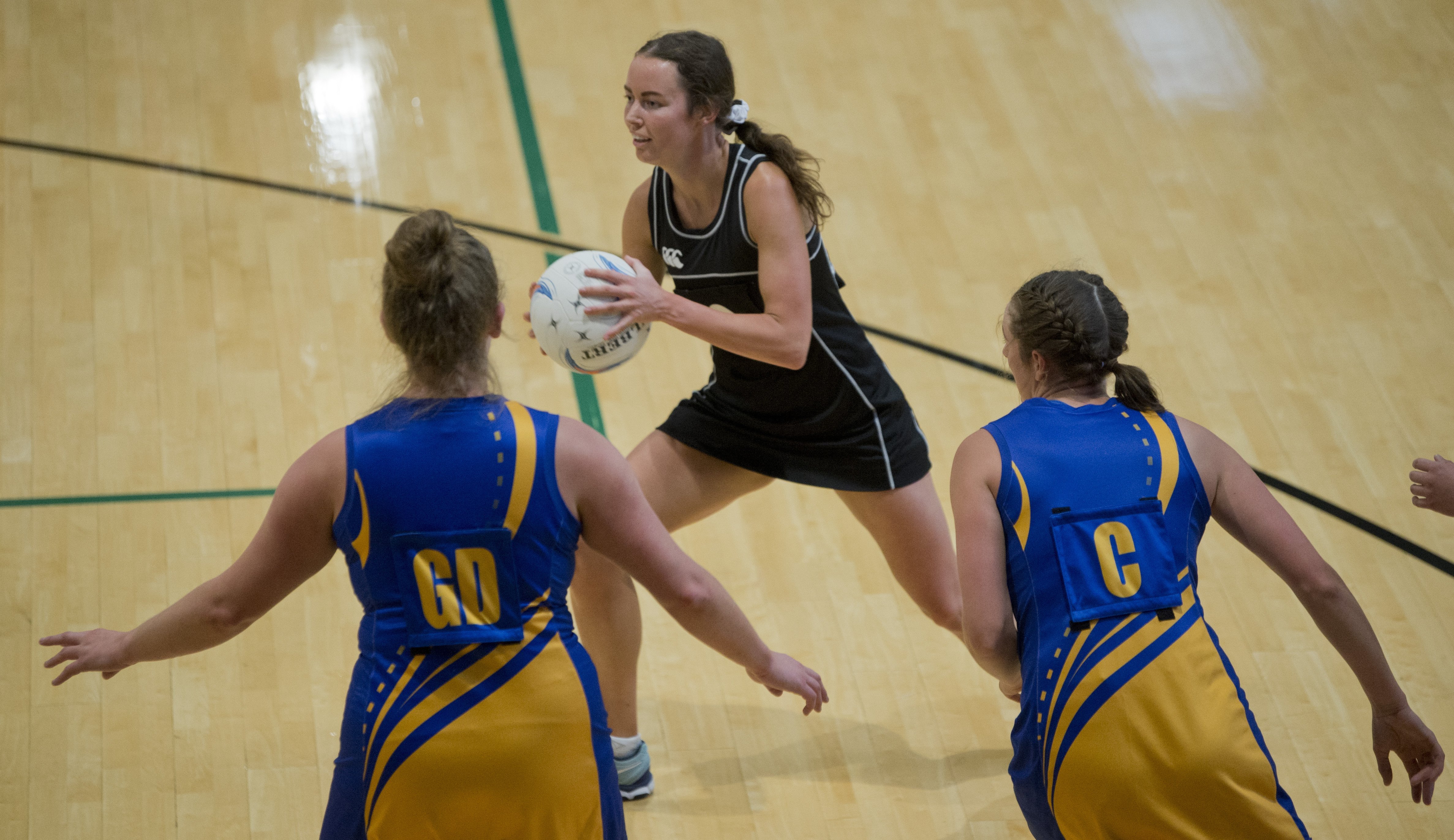 Southern centre Grace Herdman looks for options as Taieri players Lucy Geddes (left) and Rachel...