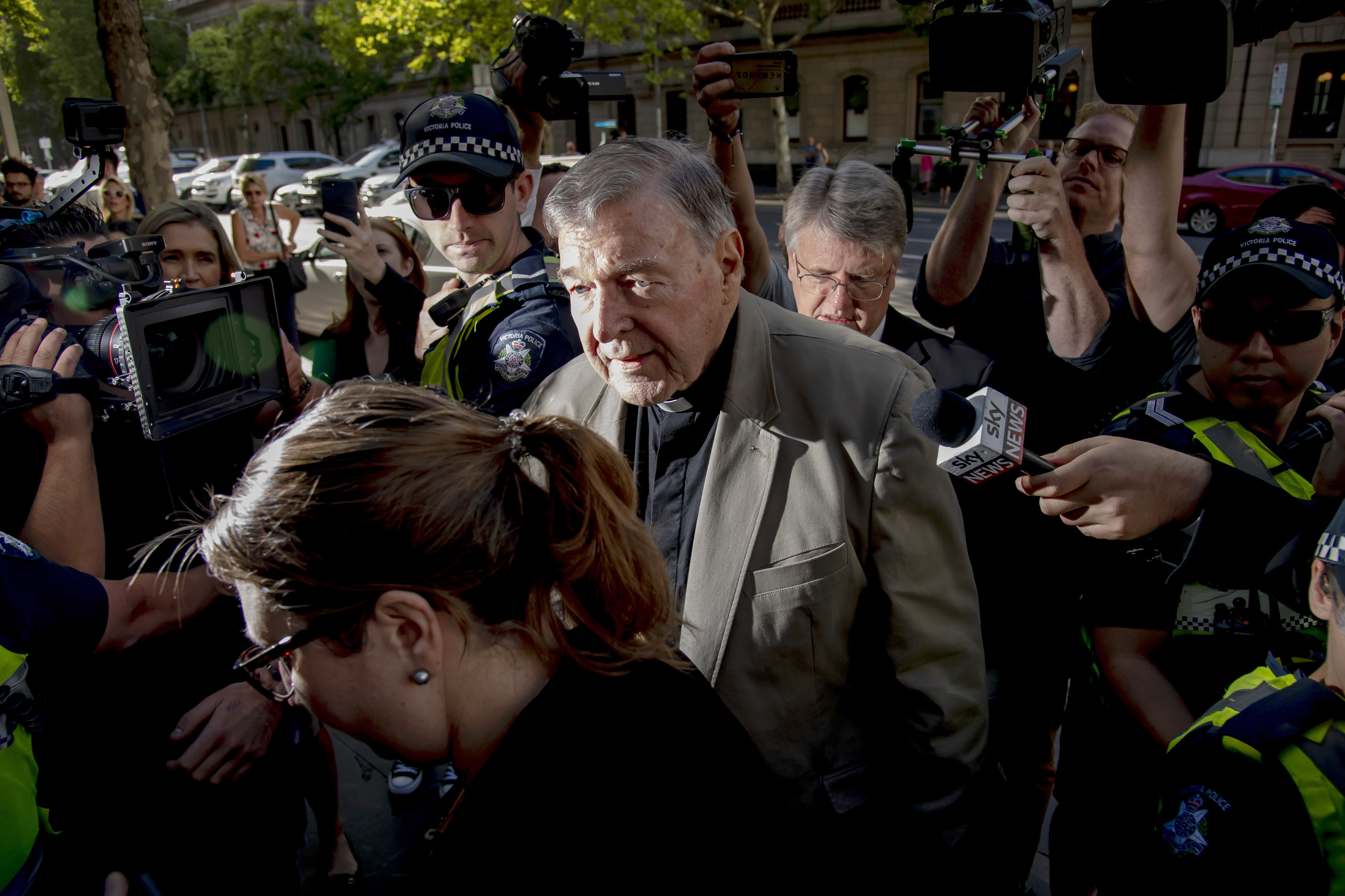 Cardinal George Pell surrounded by media at the County Court in Melbourne this week. The enormous...