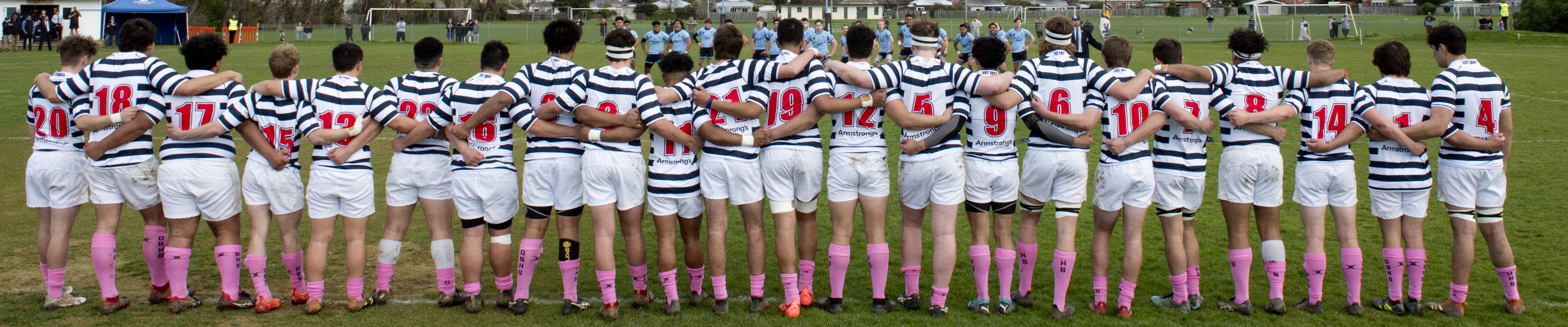 Wearing pink socks in a show of solidarity against homophobic bullying, the Otago Boys High School first XV face off the Kings High School haka before their interschool rugby match. Photo: Gerard O'Brien