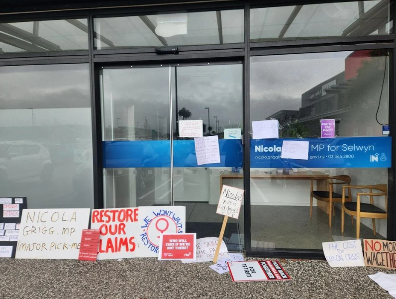 Protesters left signs outside National MP Nicola Grigg's Rolleston office. Photo: RNZ