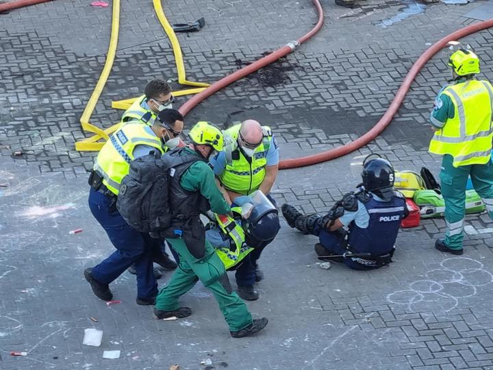 RNZ reported that several police appeared to be injured. Photo: RNZ