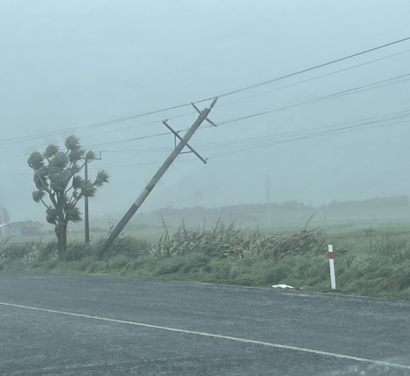 A power pole leans in the wind in Bluff. Photo: Gerrit Doppenberg