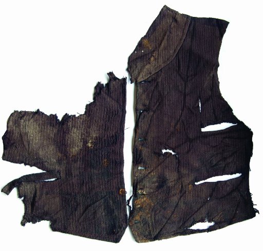 A man's waistcoat, originally a deep maroon colour, was recovered from the edge of a former...