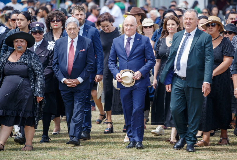 Prime Minister Christopher Luxon, flanked by Deputy Prime Minister Winston Peters and NZ First MP...