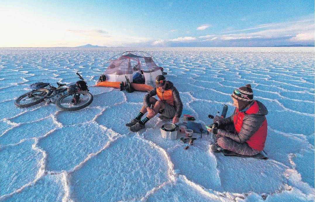 Watson and Black enjoy a brew on the salt flats of Salar de Uyuni in 2019. PHOTO: MARK WATSON
