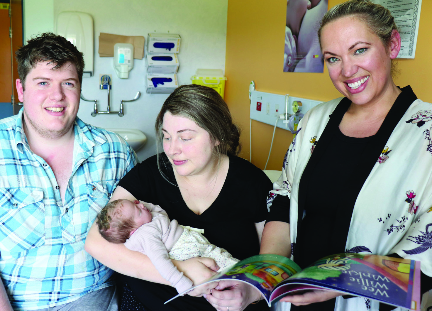 Gina White (far right), President of the Southland Literacy Society gives Lee Pemberton and...