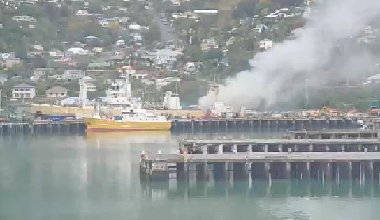Smoke pours from a ship fire in Lyttelton in 2016. The volunteer brigade was part of the...