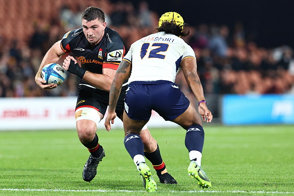 New All Blacks loose forward Simon Parker carries the ball for the Chiefs as Brumbies second five...