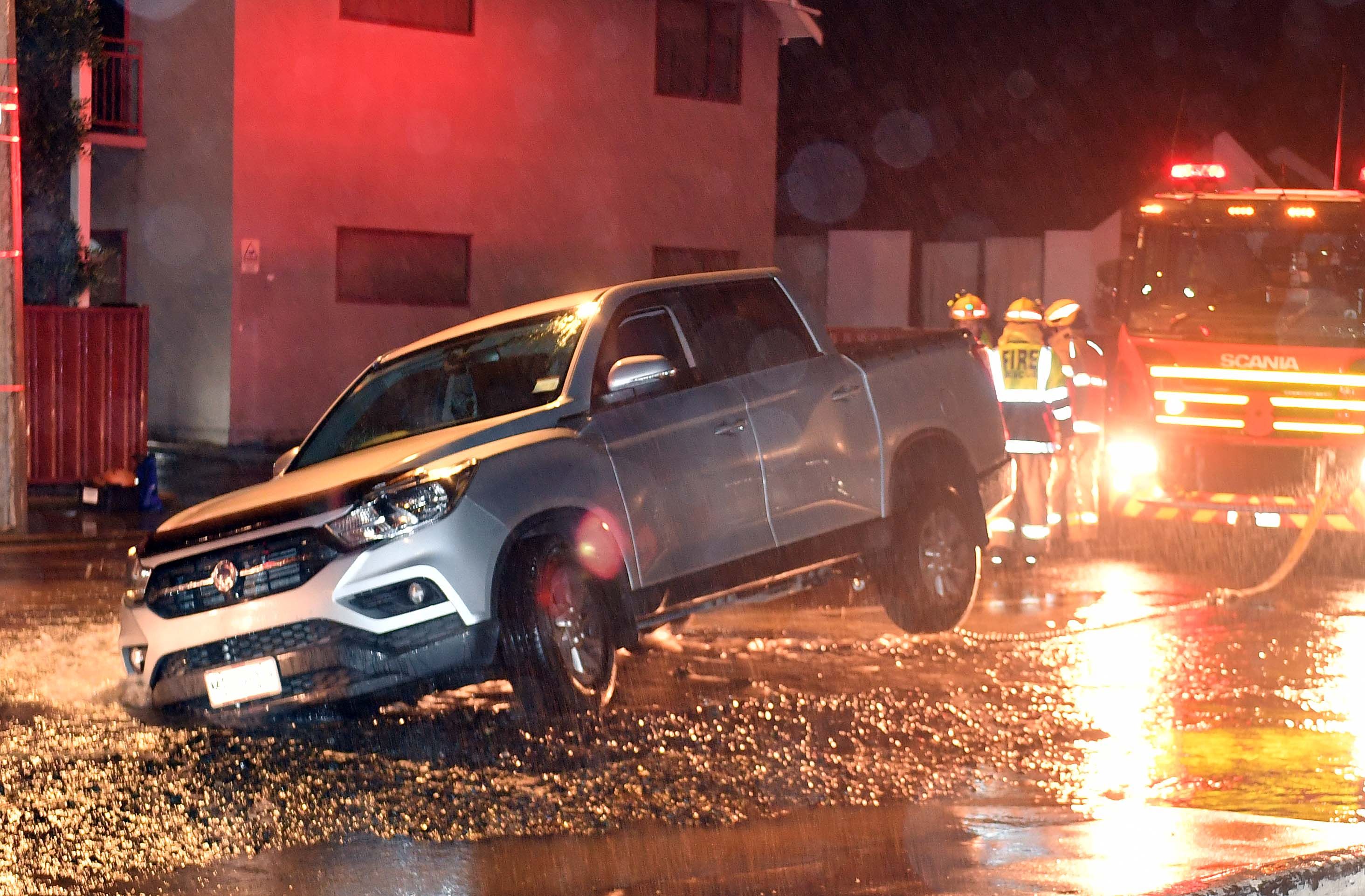Emergency services were called about 4.30am after the ute got stuck in the hole. 
