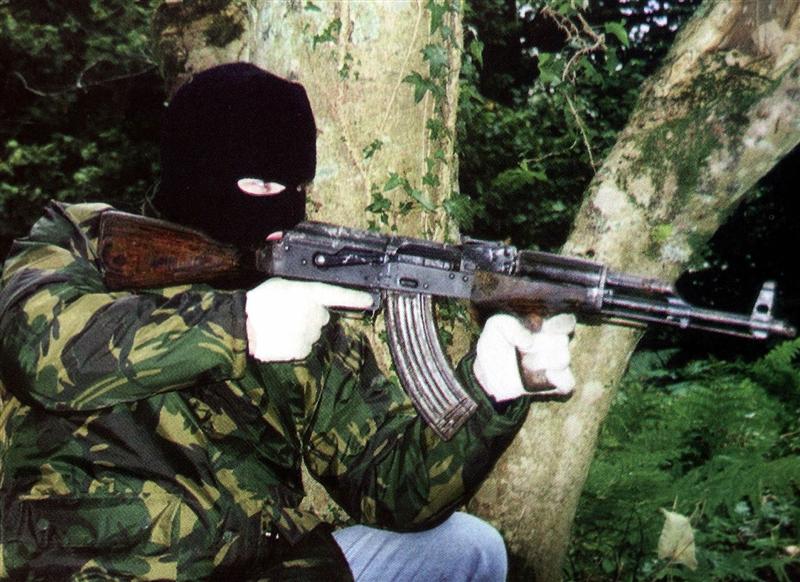 file_photo_of_an_ira_member_posing_with_ak_47_assa_4f59a24b8b.JPG