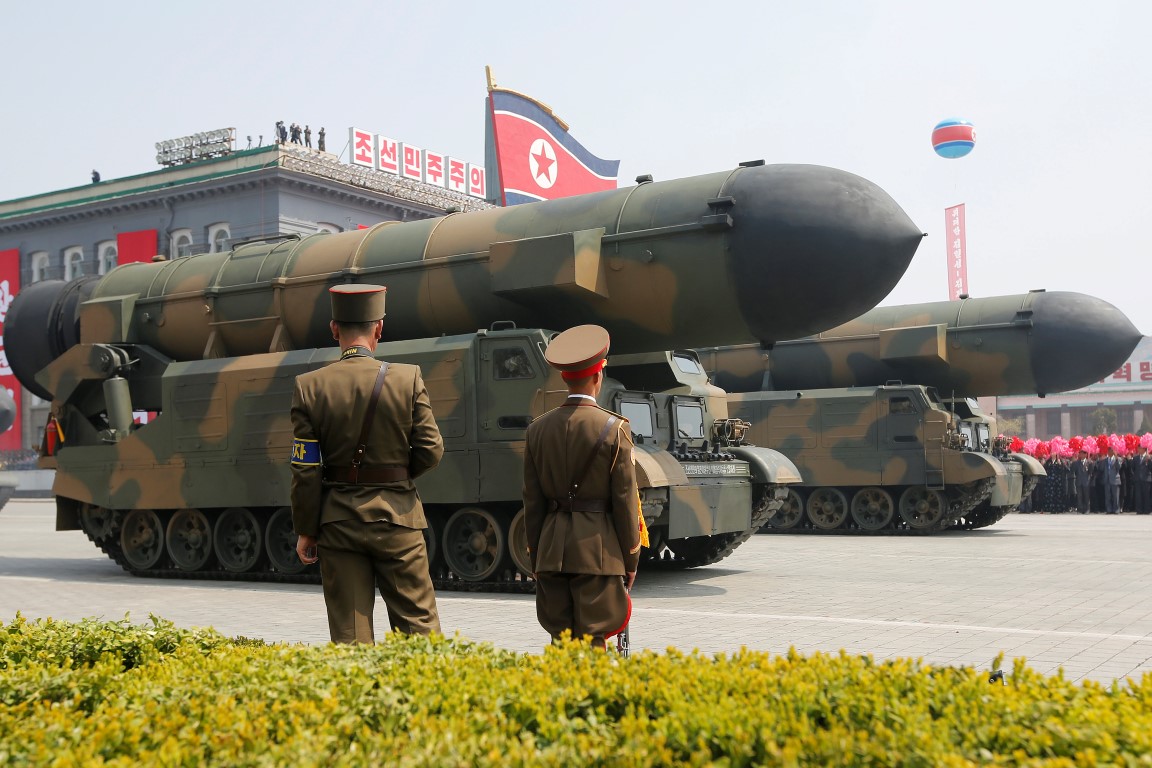 Missiles are driven past a stand with North Korean leader Kim Jong Un during a military parade...