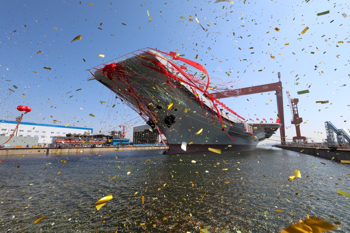 China's first domestically built aircraft carrier during its launching ceremony in Dalian, China....