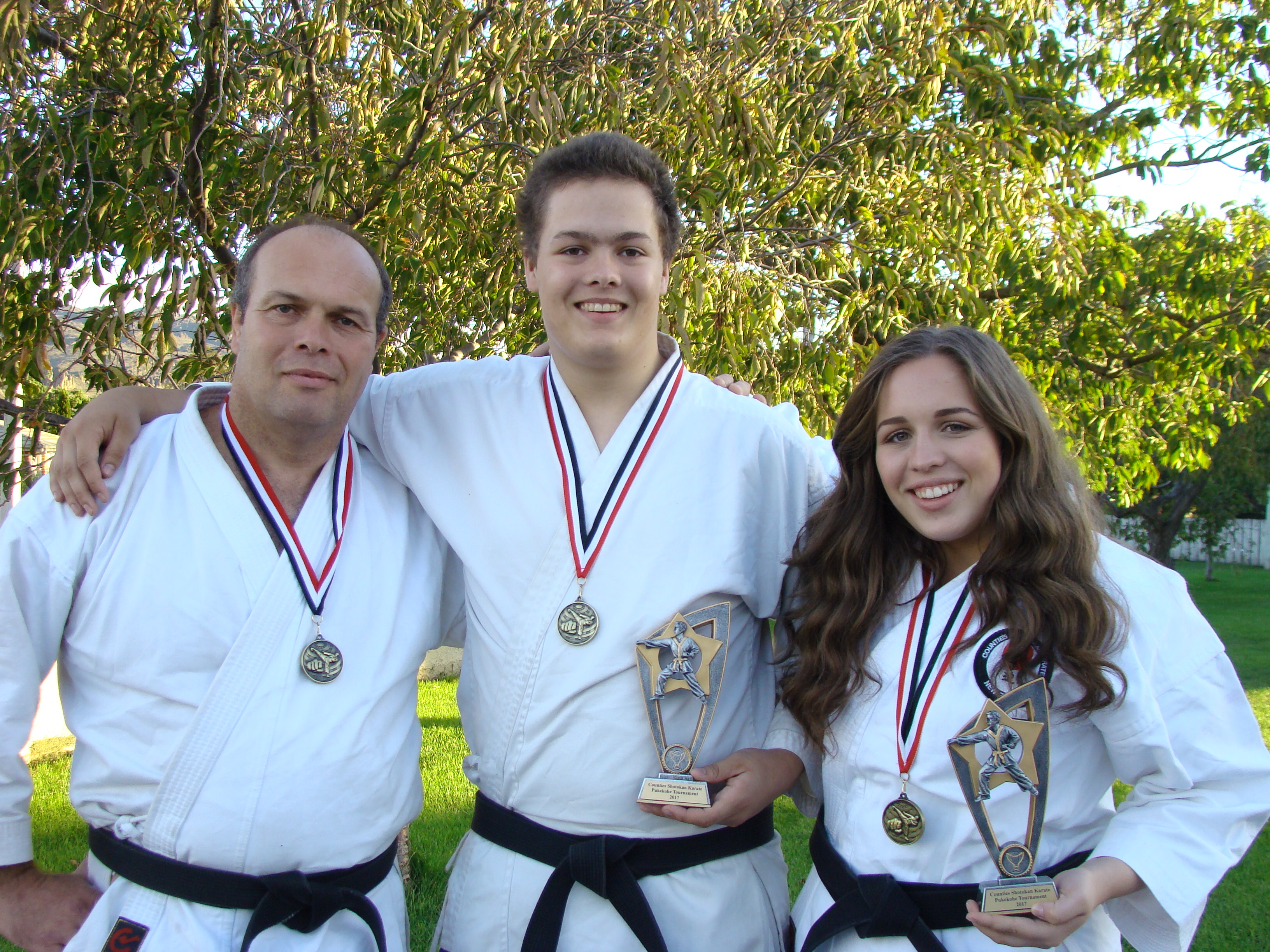 (From left) Bruce, Rohan (18) and Moragn (16) Potter proudly display the awards won by the...