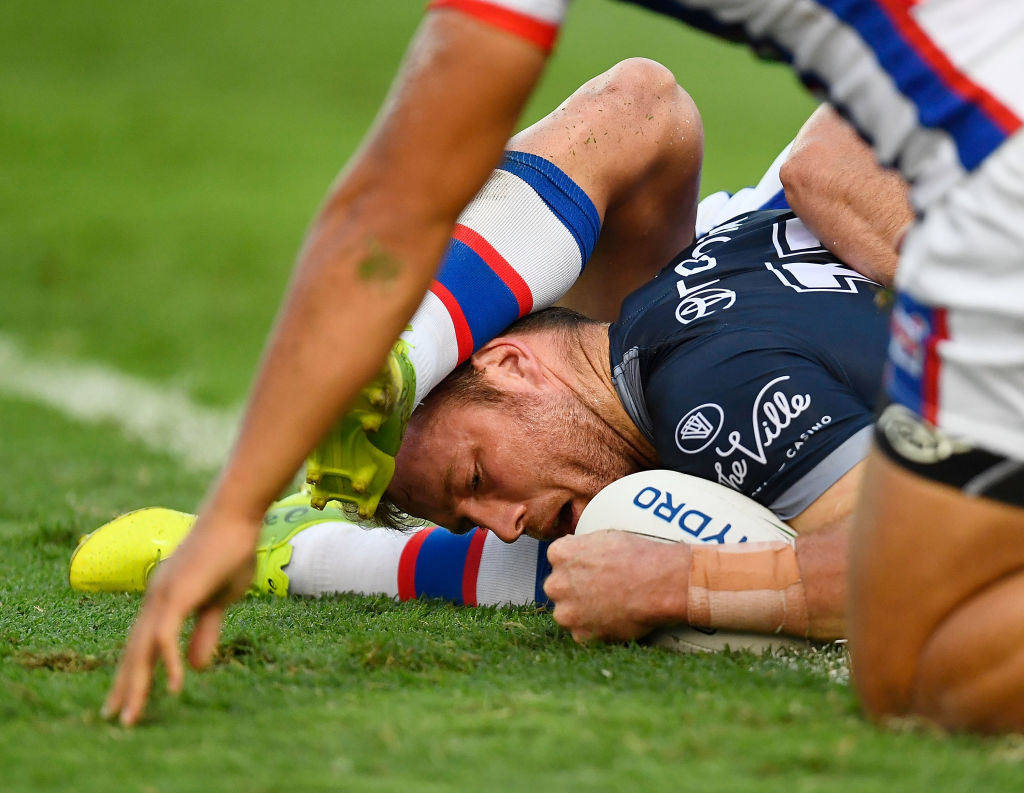 Gavin Cooper of the Cowboys scores a try. Photo: Getty