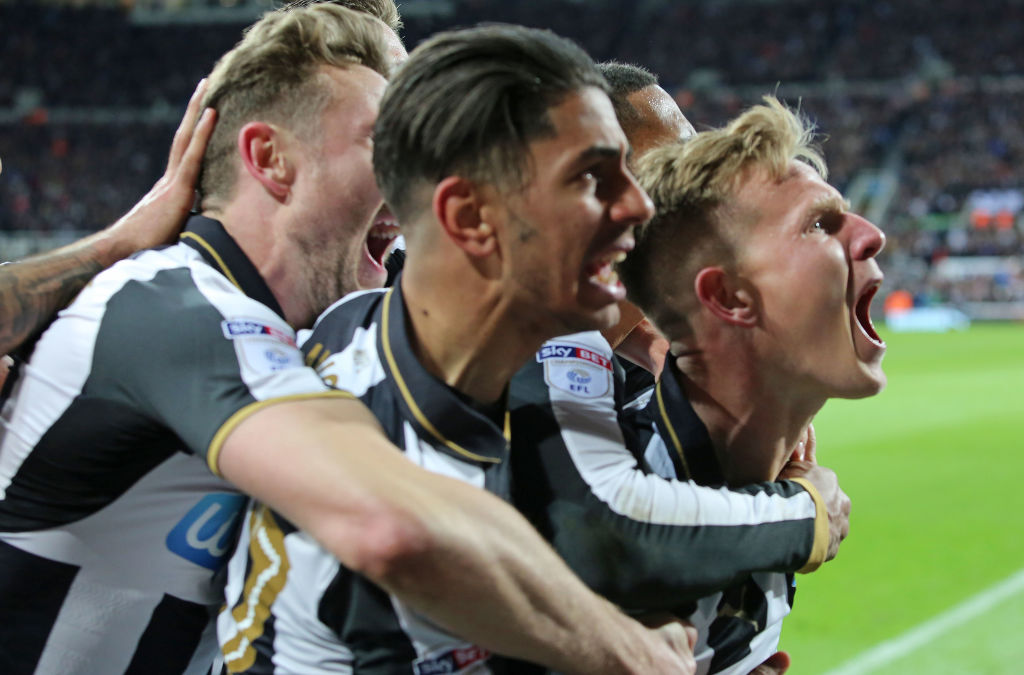 Newcastle players celebrate after Matt Ritchie (R) scored from the penalty spot against Preston....