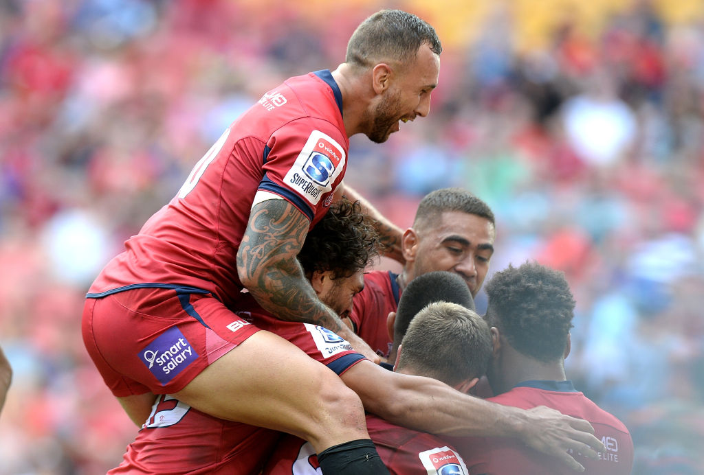 Quade Cooper celebrates with teammates. Photo: Getty Images